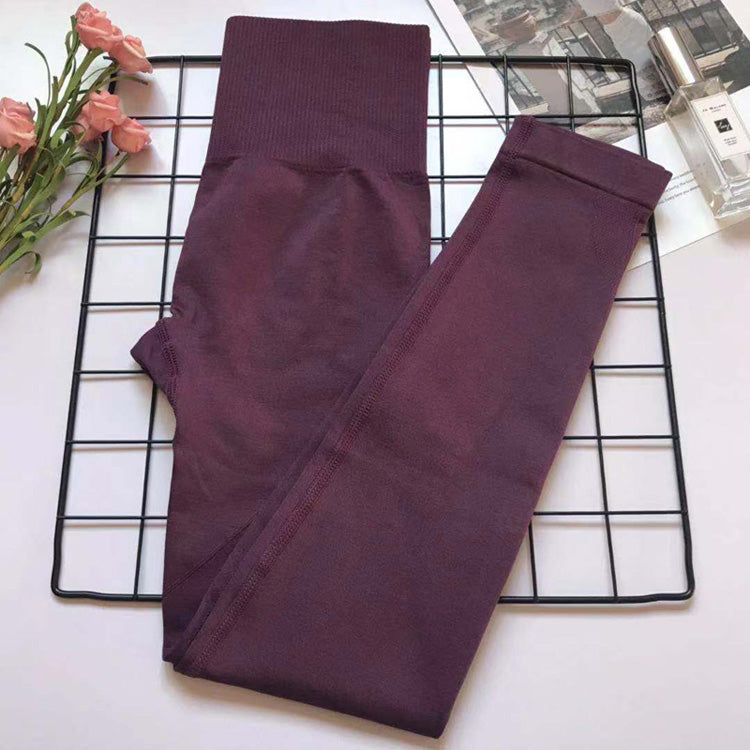 Purple Women's Athletic Set with high-waist leggings and matching bra, sculpting and breathable fabric.