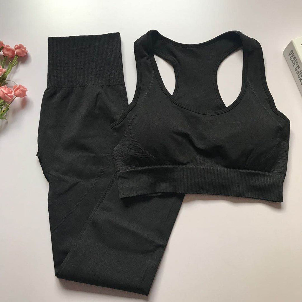 Black women's athletic set with a sporty bra and high-waisted leggings.