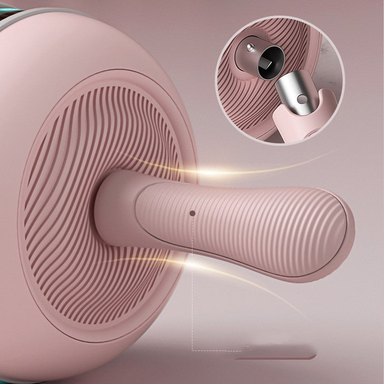 Pink Ab Wheel with LED light, USB charging, automatic rep counting, close-up handle and textured wheel.