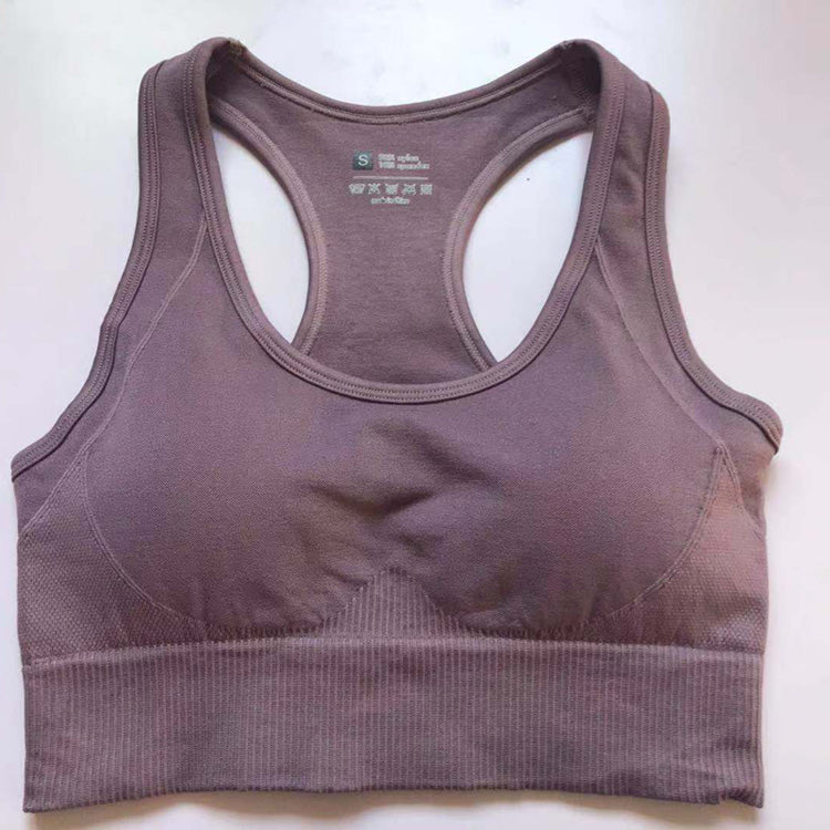 Mauve women's athletic sports bra with wide straps and ribbed band, from a high-waist set.